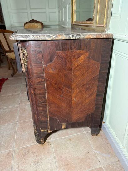 An important chest of drawers with a curved...