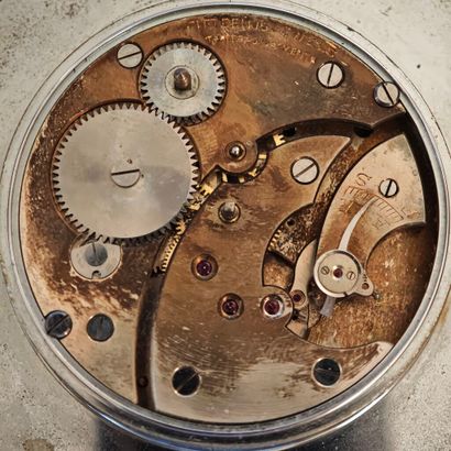 Anonymous. Polished steel table clock on...