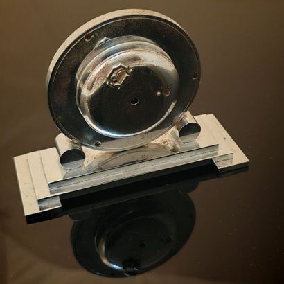 Anonymous. Polished steel table clock on...