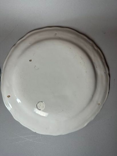 MOUSTIERS. 
Set of four earthenware rimmed...