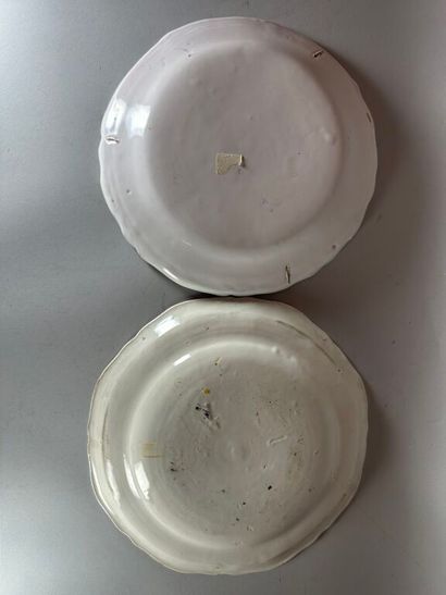 MOUSTIERS.
Two earthenware plates with contoured...