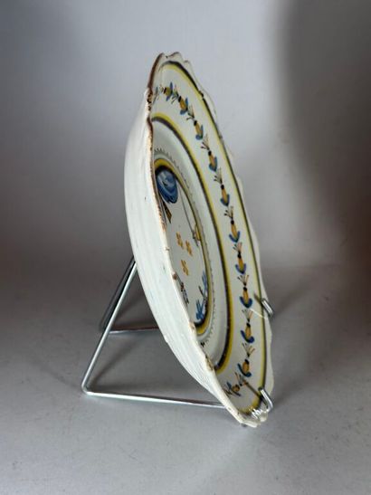 NEVERS.
Earthenware rimmed plate with pre-Revolutionary...