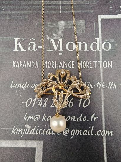 A 750‰ gold and 950‰ platinum brooch-pendant...