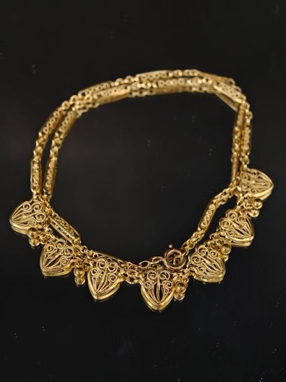 A 750‰ yellow gold filigree-style necklace...