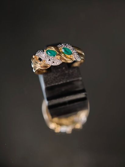 750‰ yellow gold ring, with a sinuous, interlaced...