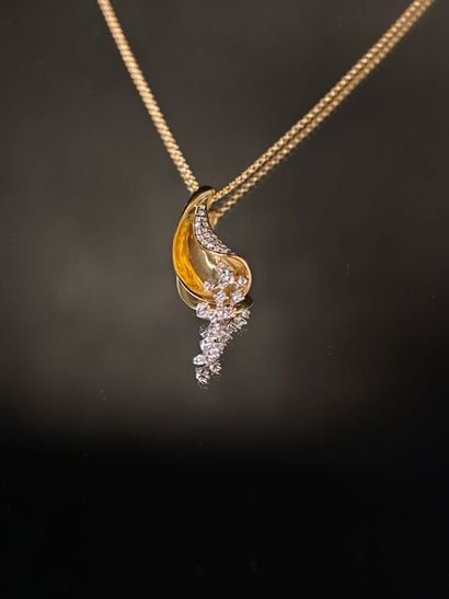 A 750‰ yellow gold pendant consisting of...