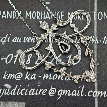 A 750‰ gold garland-style pendant, crudely...
