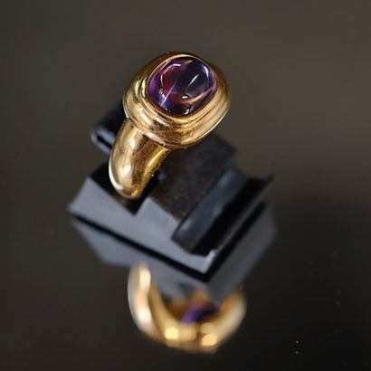 A 750‰ yellow gold band ring, set with an...