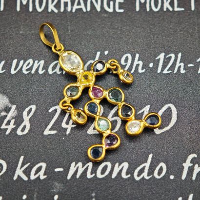 A 750‰ yellow gold pendant featuring an anthropomorphic...