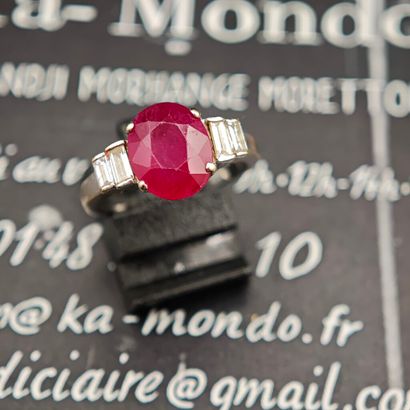 A 750‰ white gold ring set with an oval composite...