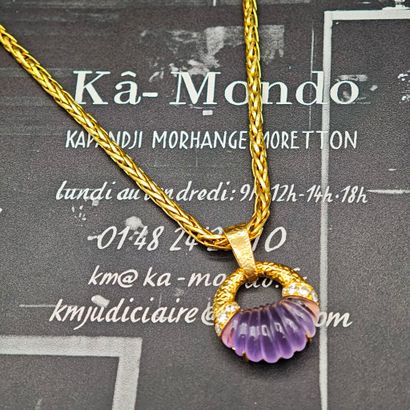 A 750‰ yellow gold pendant consisting of...