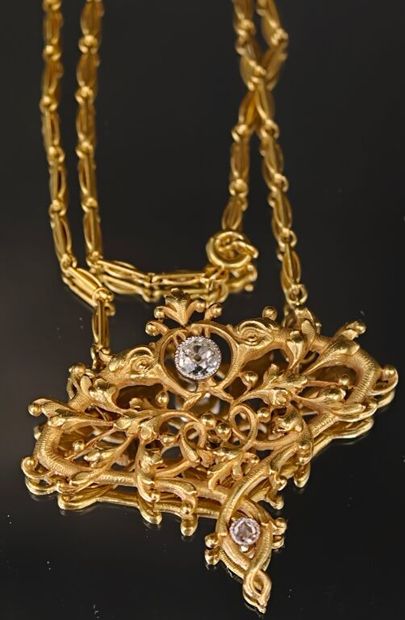 A 750‰ gold pendant, chiseled and re-drilled...