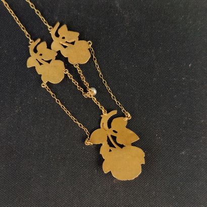 Yellow gold necklace adorned with rose motifs,...