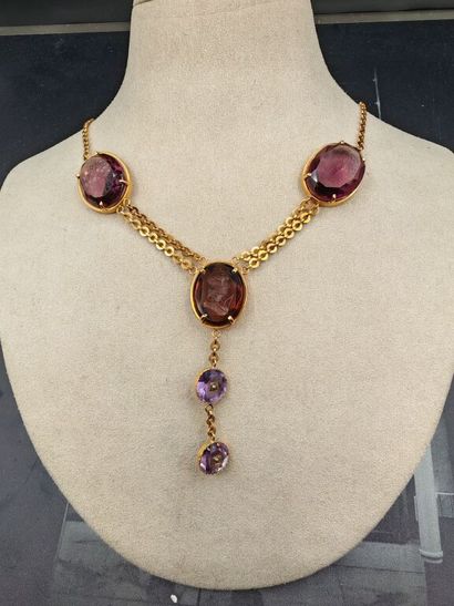 A yellow gold necklace consisting of a single...