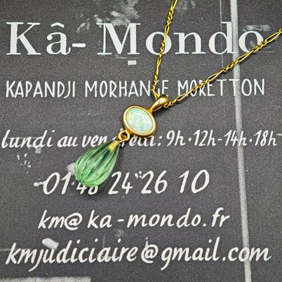 A 750‰ yellow gold pendant featuring an oval...
