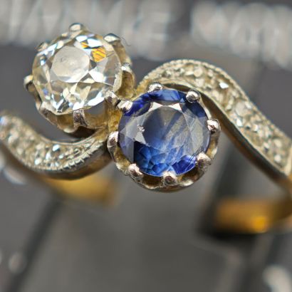 A sinuous ring known as “You and Me,” crafted...