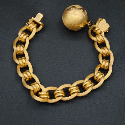 750‰ yellow gold bracelet featuring a planet...