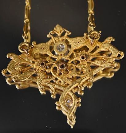 A 750‰ gold pendant, chiseled and re-drilled...
