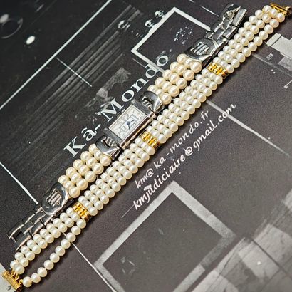 A bracelet featuring three rows of freshwater...