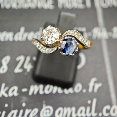 A sinuous ring known as “You and Me,” crafted...