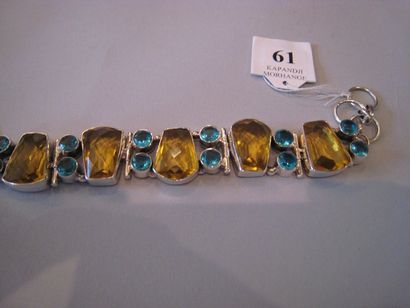 Bracelet orné de pierres jaunes et bleue...