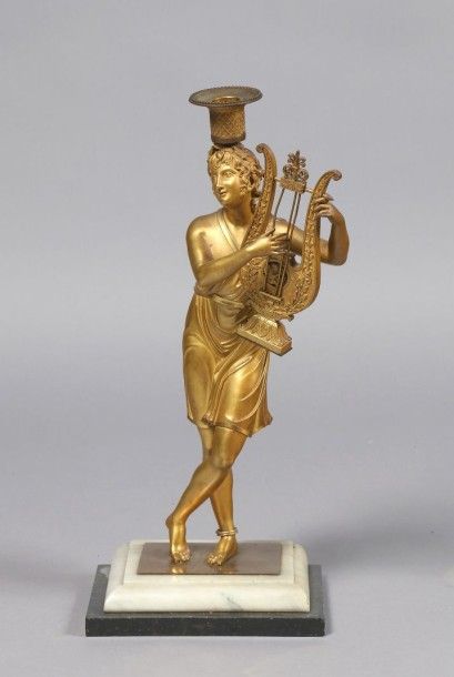 Élément de pendule en bronze ciselé et doré...