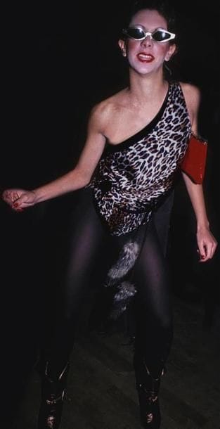 WOMAN IN LEOPARD TOP.
By Rose Hartman.
Studio...