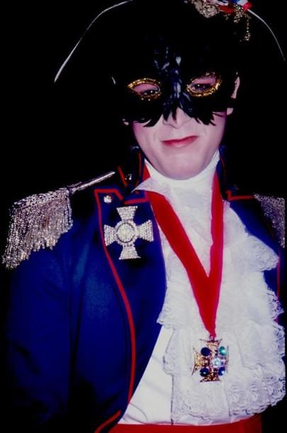 MASKED MAN IN CAPTAIN EVENING DRESS.
By Rose...