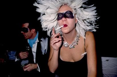 YOUNG MASKED WOMAN.
By Rose Hartman.
Mudd...
