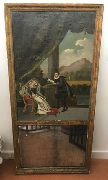 Un petit trumeau en bois doré à décor en...