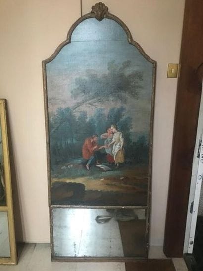 Un trumeau en bois doré à décor dune toile...