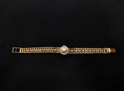 ROLEX
Montre bracelet de dame ronde en or...