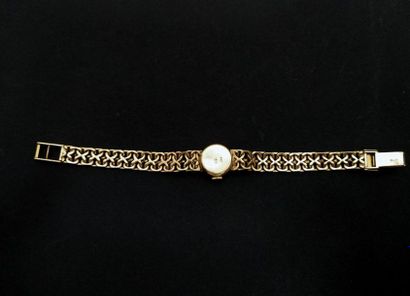 ROLEX
Montre bracelet de dame ronde en or...