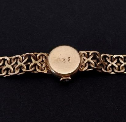 ROLEX
Montre bracelet de dame ronde en or...