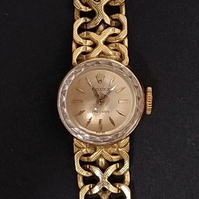 ROLEX
Montre bracelet de dame ronde en or...