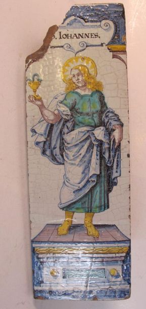 Angle de poêle en faïence émaillée à décor...