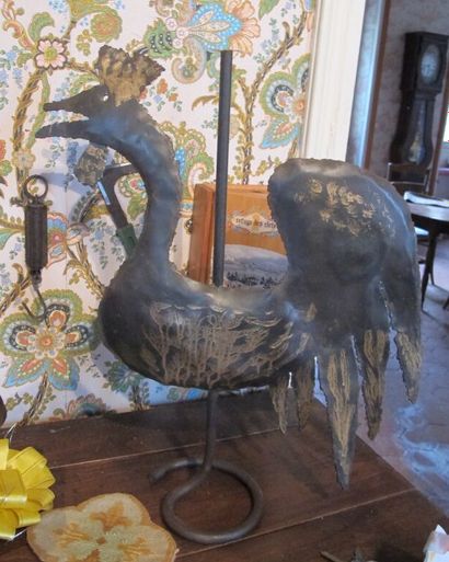 Two metal sculptures depicting a rooster...
