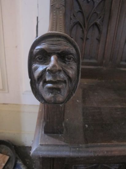 Carved wooden bench with Gothic decor

H....