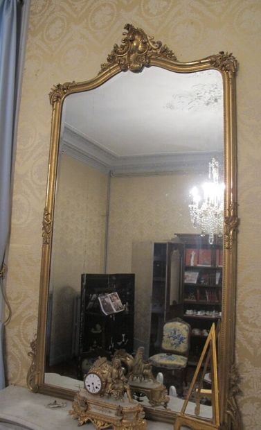 Wood and gilded stucco overmantel mirror...