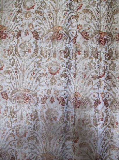 Three curtains with cream background with...
