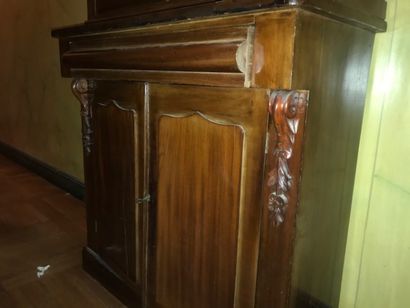 Small mahogany bookcase with two glass doors...