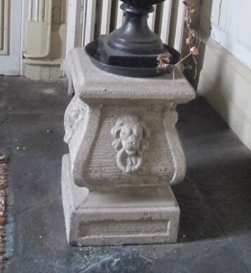 Pair of reconstituted stone pedestals decorated...