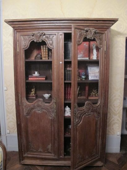 Oak cupboard with two latticed doors forming...
