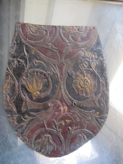 Set of two embossed and gilded leather elements...