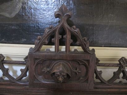 Carved wooden bench with Gothic decor

H....
