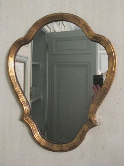 Four gilded wood mirrors in a fretworked...