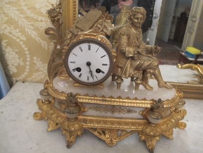 Clock in gilded metal and stone representing...