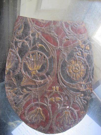 Set of two embossed and gilded leather elements...