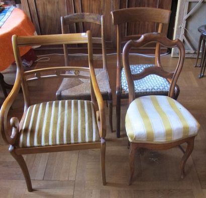 Eight mismatched wooden dining chairs

We...