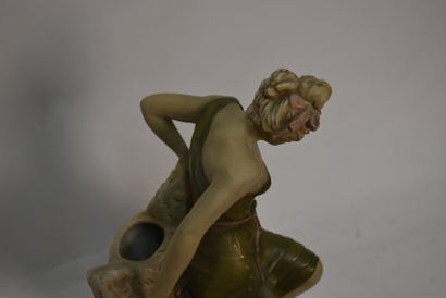 Polychrome ceramic vase with female figure

Royal...